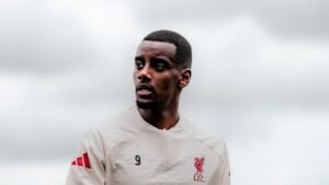Alexander Isak wearing white Liverpool training kit
