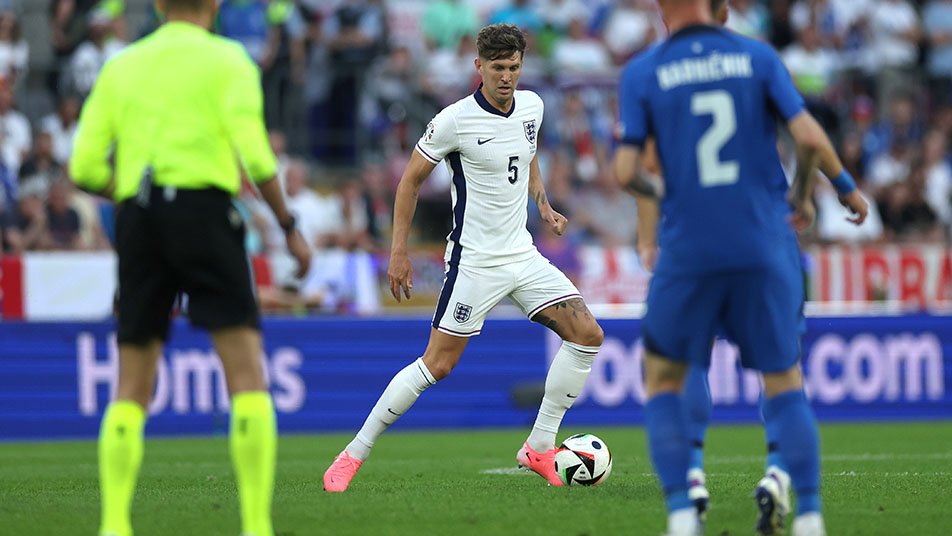John Stones of England runs with the ball during the UEFA EURO 2024 group stage match between England and Slovenia at Cologne Stadium on June 25, 2024 in Cologne, Germany.
