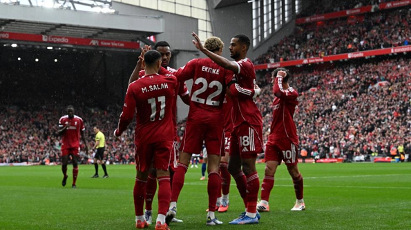 Liverpool team celebrating goal against Everton in Merseyside derby