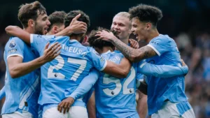 Manchester City players celebrating a goal against Burnley