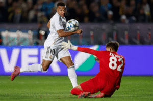 Kylian Mbappe scoring his second goal for Real Madrid against Kairat Almaty in the Champions League