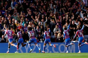 Crystal Palace players celebrating their Premier League win over Liverpool