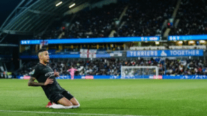 Savinho celebrating a goal for Manchester City against Huddersfield