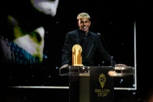 Lamine Yamal standing on the ballon d'or podium