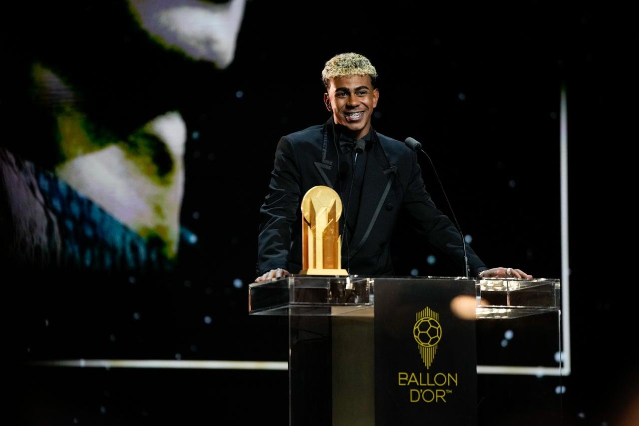 Lamine Yamal standing on the ballon d'or podium