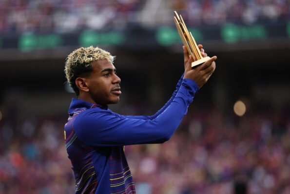 Lamine Yamal presenting the Kopa Trophy to Barcelona fans at the Estadi Olimpic Lluis Companys at Montjuic