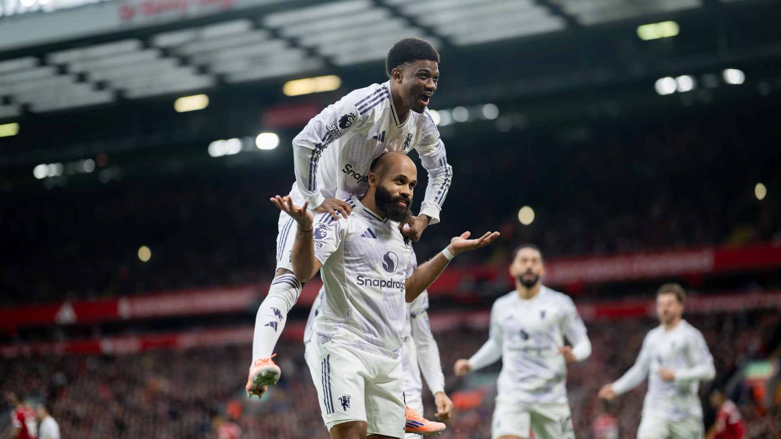 Amad Diallo and Bryan Mbeumo celebrating Manchester United's opener against Liverpool