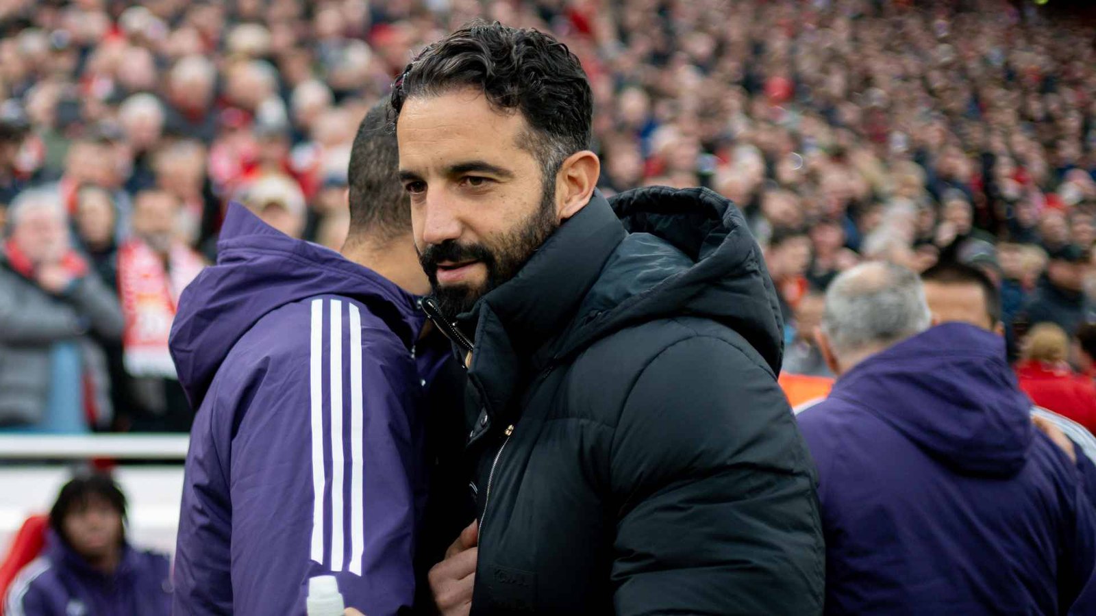 Manchester United coach Ruben Amorim hugging his player at Anfield