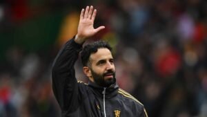 Ruben Amorim waving to Manchester United supporters