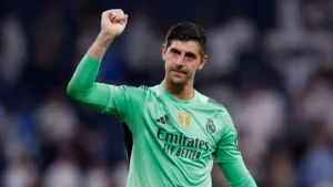 Real Madrid goalkeeper Thibaut Courtois hailing the fans while on the pitch