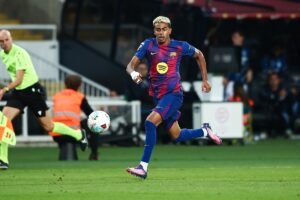 Barcelona winger Lamine Yamal chasing the ball during a match