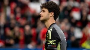 Manchester United goalkeeper Senne Lammens standing at Old Trafford