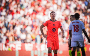 Barcelona striker Robert Lewandowski standing in the stadium in the match against Sevilla