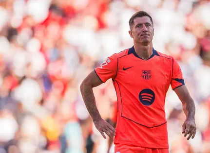 Barcelona striker Robert Lewandowski standing in the stadium in the match against Sevilla
