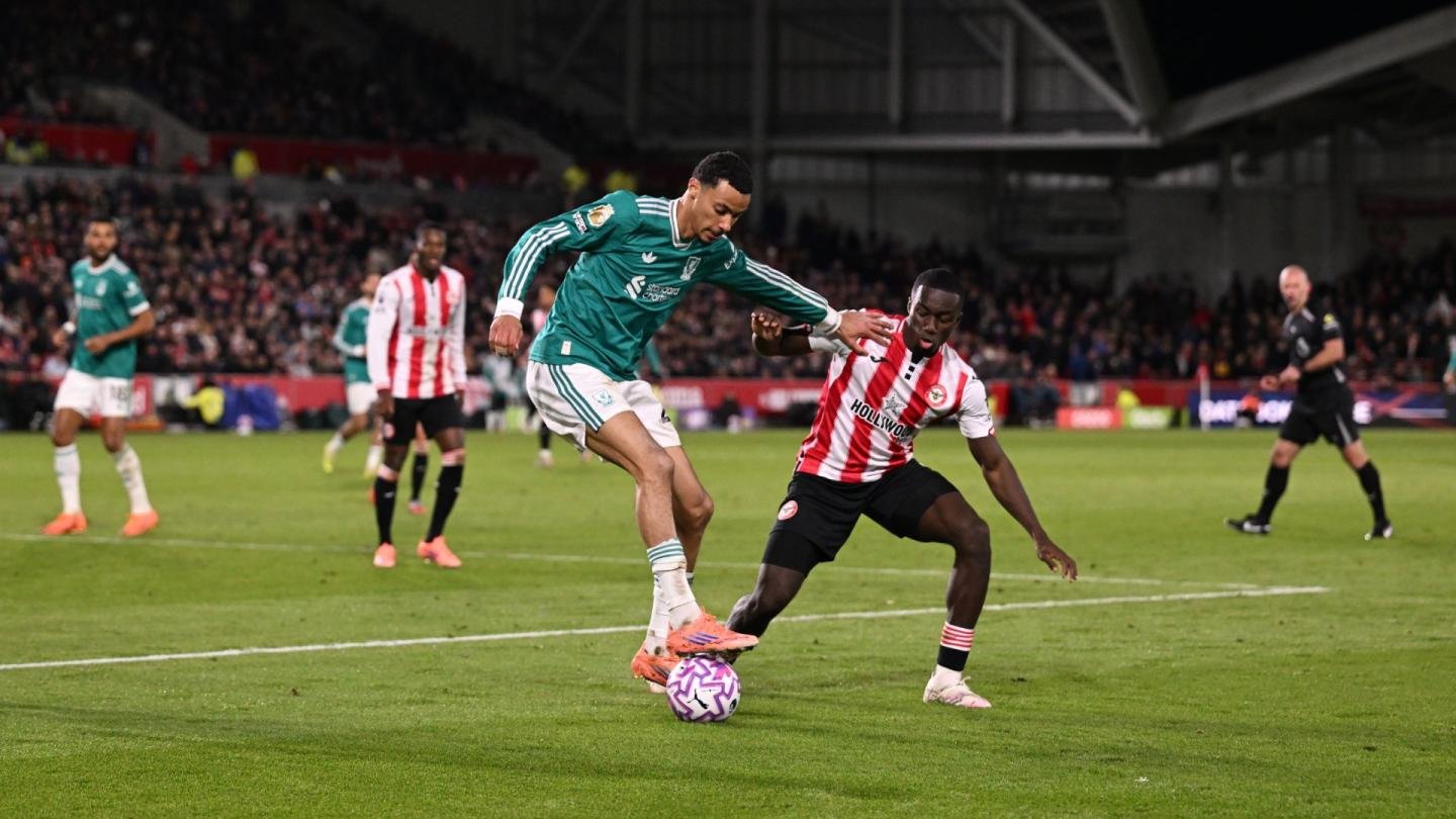 Liverpool forward Hugo Ekitike holding off a challenge against Brentford