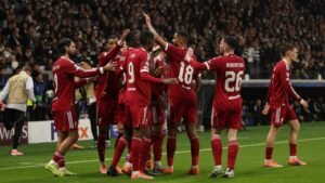 Liverpool players celebrating a goal against Eintracht Frankfurt in the Champions League