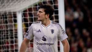 Harry Maguire celebrating his winner at Anfield