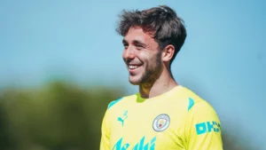 Manchester City midfielder Nico Gonzalez smiling in training