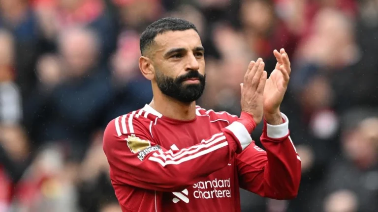 Mohamed Salah applauding Liverpool fans in a Premier League match at Anfield