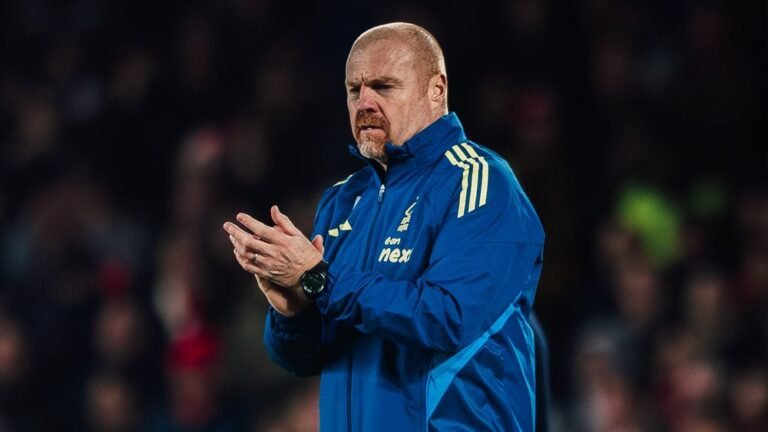 Sean Dyche applauding Nottingham Forest fans in a stadium