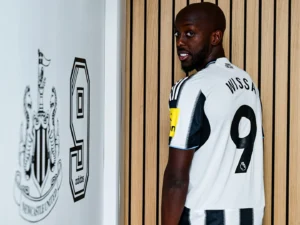 Yoane Wissa posing in a Newcastle shirt after the club announced his signing