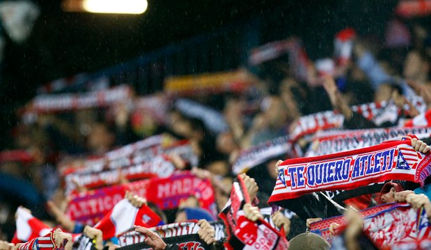 Atletico Madrid fans raising banners during a match