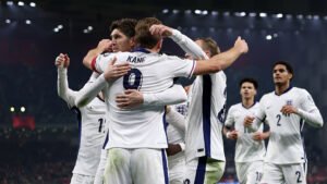 Harry Kane of England celebrates scoring his team's first goal with teammates during the FIFA World Cup 2026 qualifier match between Albania and England at Air Albania Stadium on November 16, 2025 in Tirana, Albania.