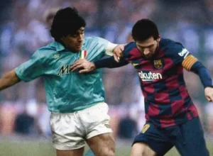 Lionel Messi vying for the ball with Maradona