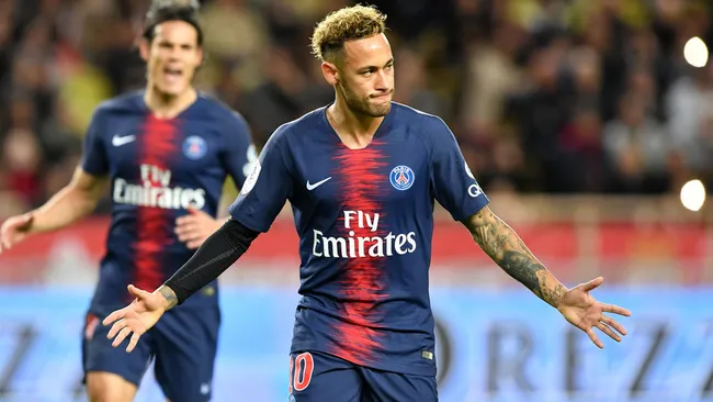 Neymar celebrating a goal for Paris Saint-Germain with Edison Cavani behind him