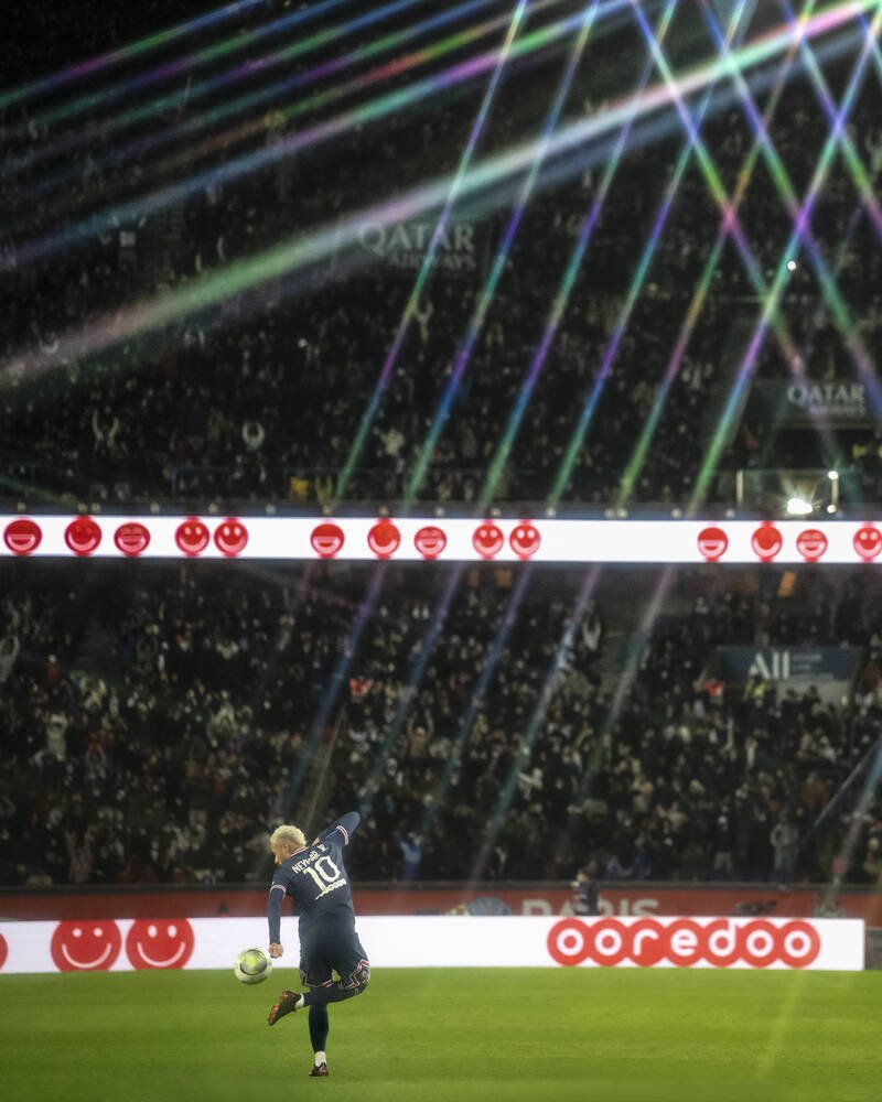 Neymar in action under spotlights at Paris Saint-Germain