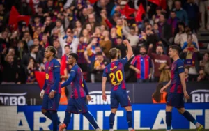 Dani Olmo celebrating alongside teammates after scoring for Barcelona