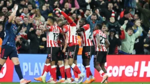 Sunderland players celebrating after scoring late against Arsenal