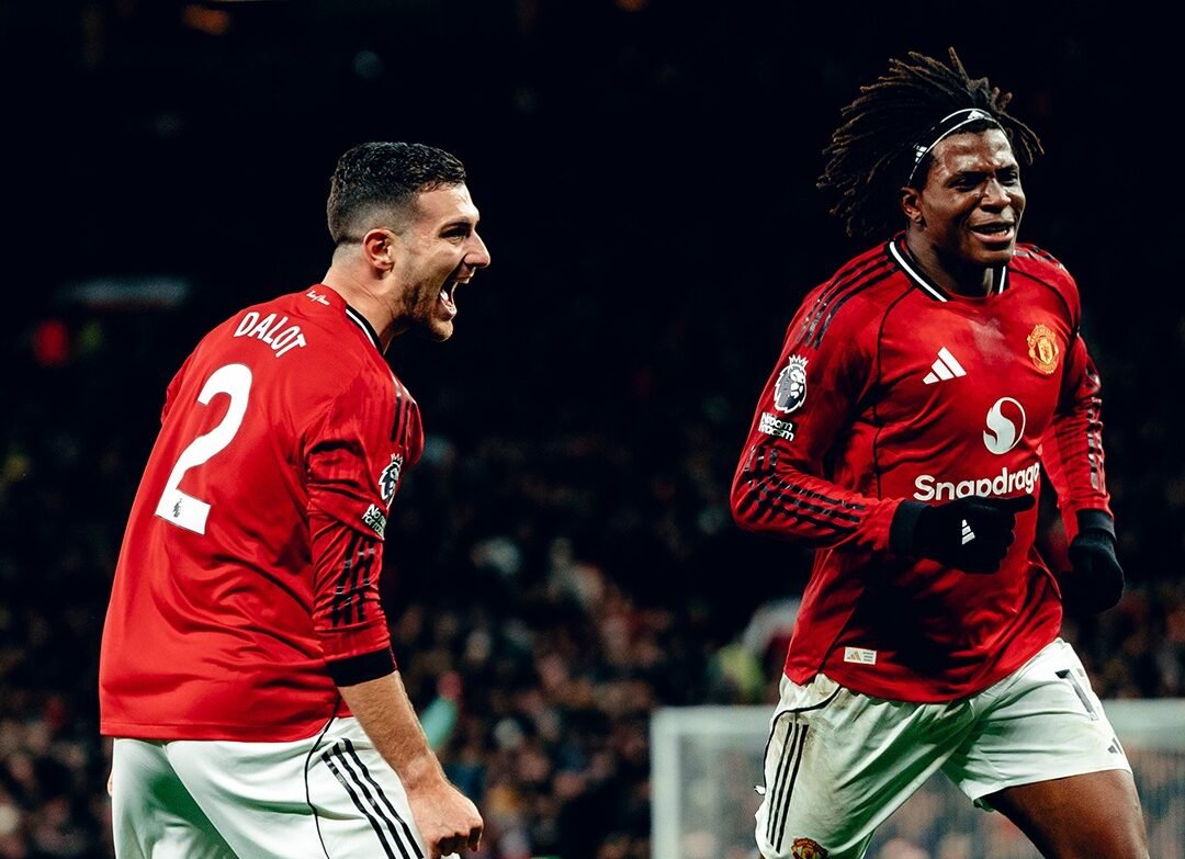 Patrick Dorgu celebrating goal for Manchester United with teammate Diogo Dalot
