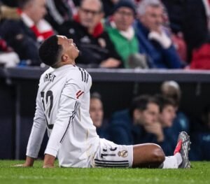 Trent Alexander-Arnold sitting on the grass after sustaining an injury while playing for Real Madrid
