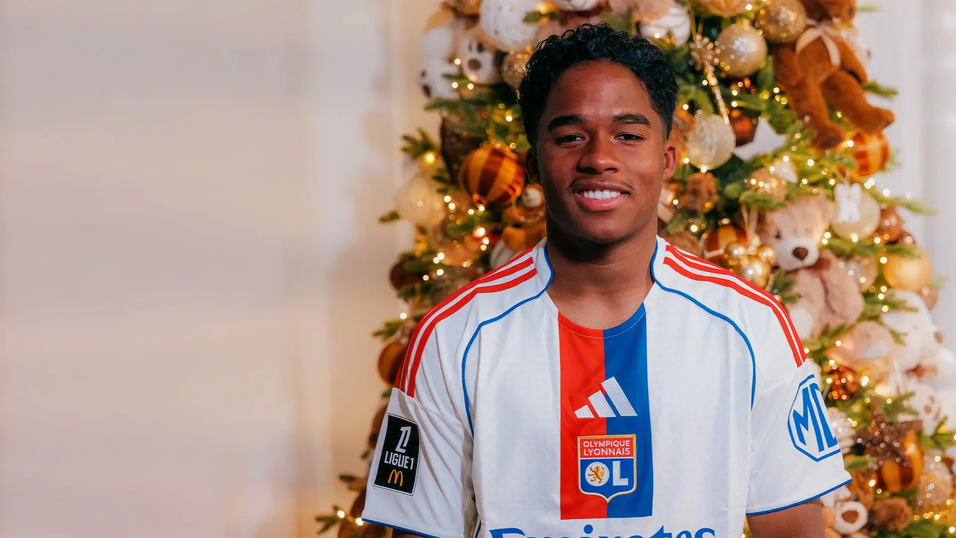 Endrick posing in Lyon shirt