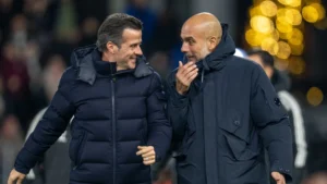 Pep Guardiola in conversation with Fulham boss Marco Silva