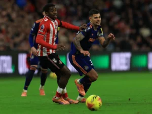 Newcastle's Bruno Guimaraes vying for the ball with Sunderland opponent
