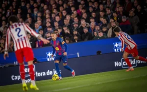 Raphinha in action for Barcelona against Atletico Madrid