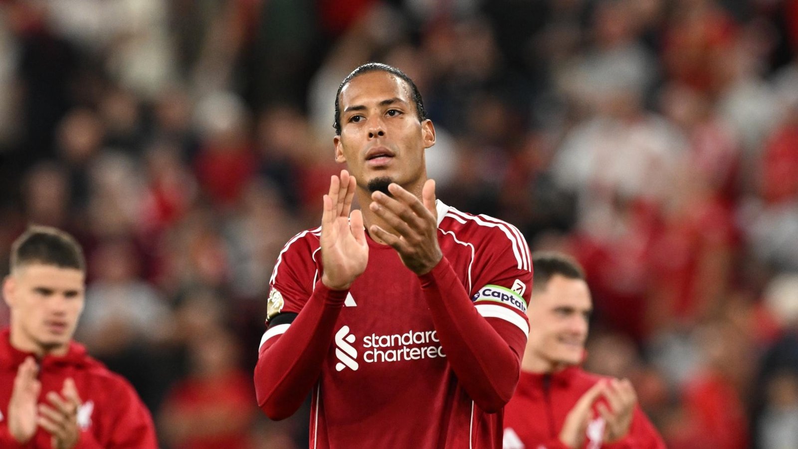 Virgil van Dijk applauding Liverpool fans