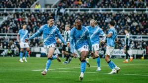 Antoine Semenyo running off to celebrate goal with Manchester City teammates