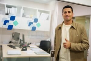 Joao Cancelo posing in a clinic after completing a medical at Barcelona