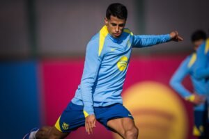 Joao Cancelo kicking the ball during a Barcelona training session
