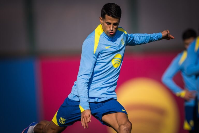 Joao Cancelo kicking the ball during a Barcelona training session