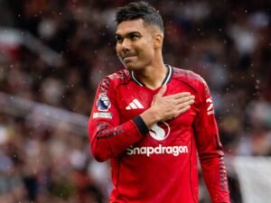Casemiro thumping the Manchester United badge