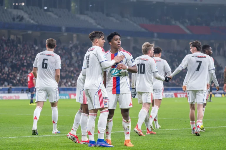 Endrick celebrating with teammates at Lyon