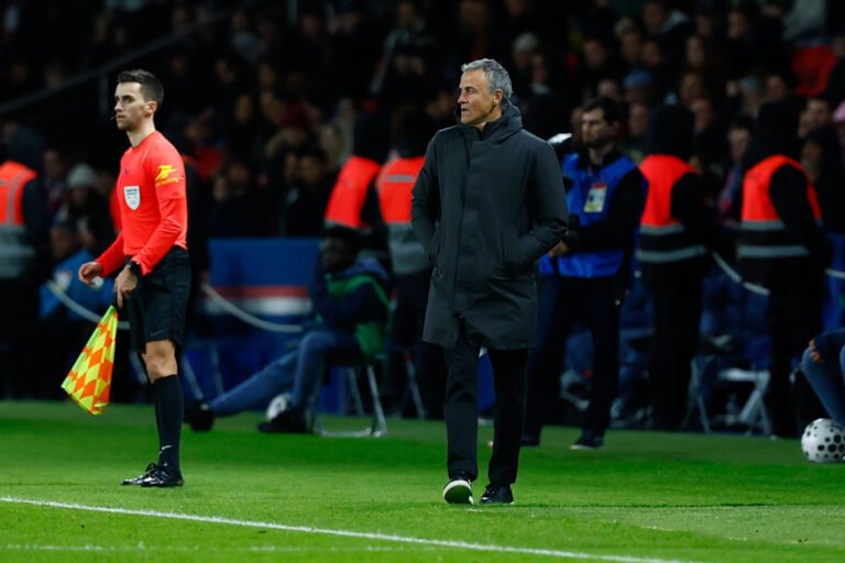 Luis Enrique walking on the sidelines in a game while in charge of Paris Saint-Germain
