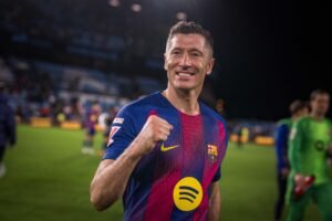Robert Lewandowski walking on the pitch after a game for Barcelona
