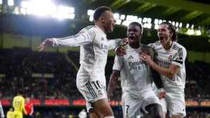 Kylian Mbappe, Vinicius and Alvaro Carreras celebrating goal