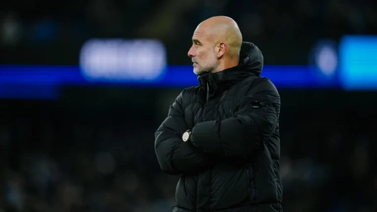Manchester City manager Pep Guardiola standing on the sidelines