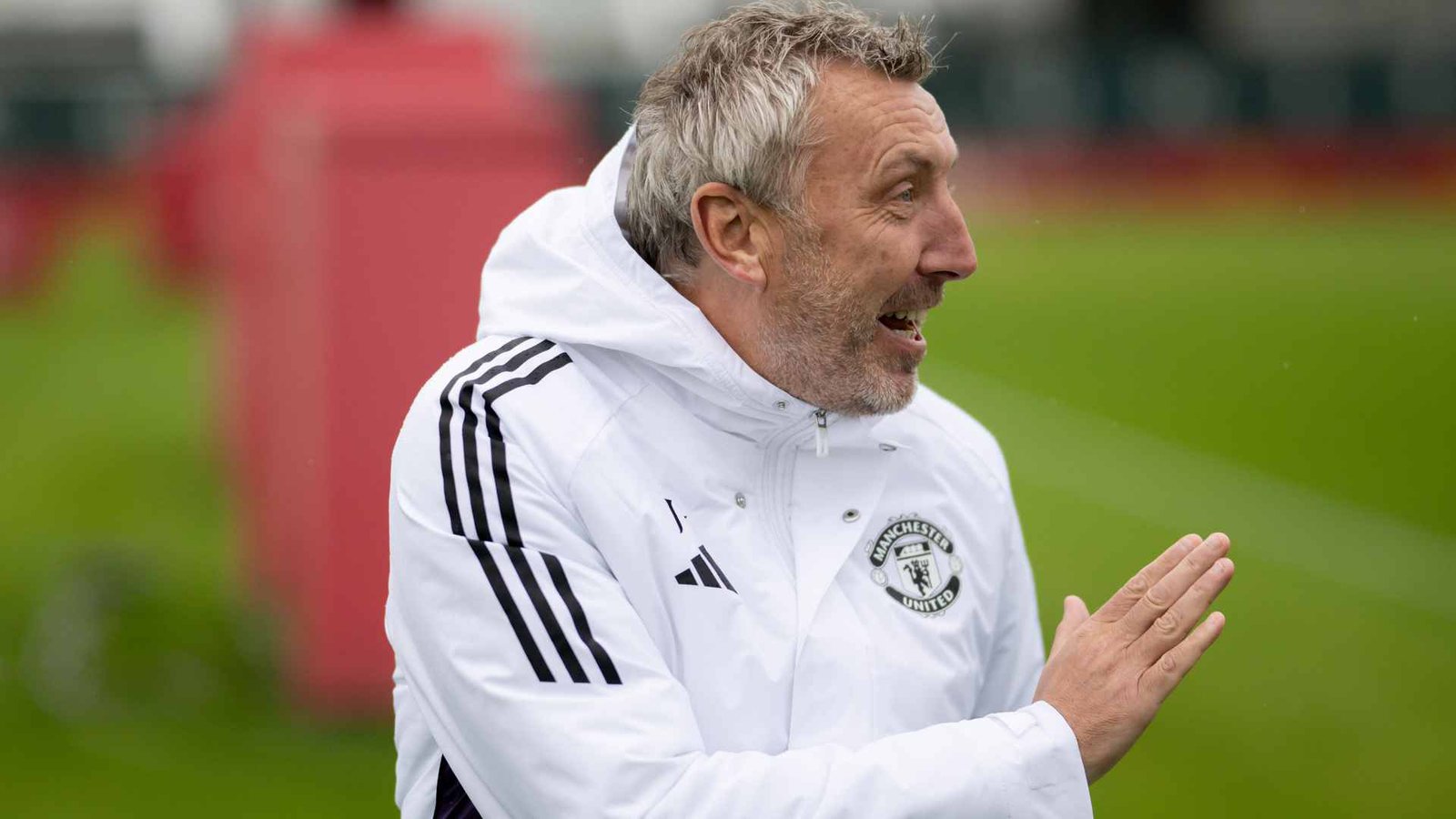 Manchester United director of football waving on the training ground at Carrington